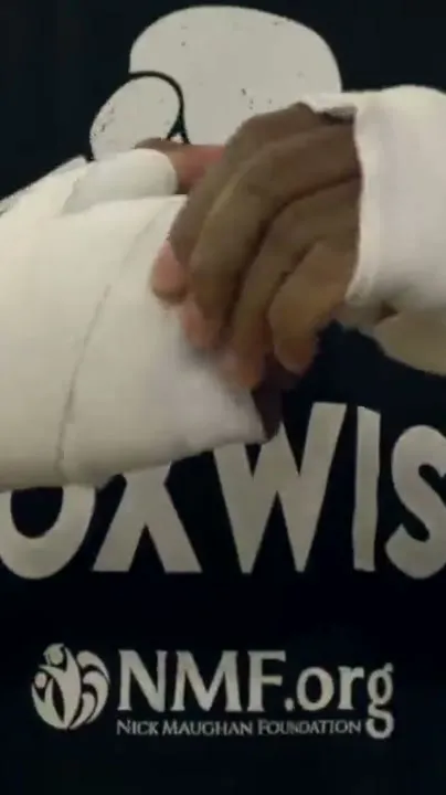 Taped hands on a BoxWise shirt